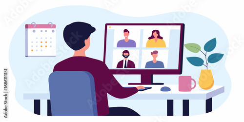 Person participating in a video conference call with colleagues on a computer screen at a desk