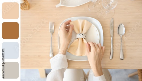 Woman setting table in dini...