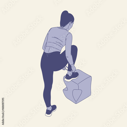 A woman tying her shoelace while standing on a cube-shaped exercise platform.