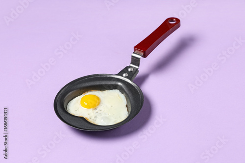 Single fried egg in small b...