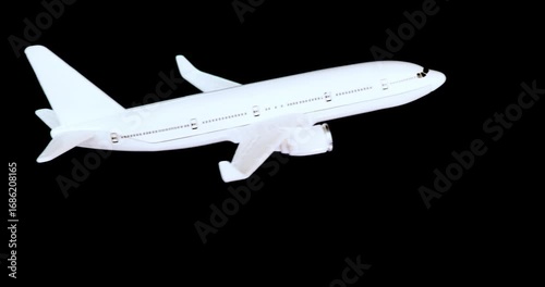 Wallpaper Mural White passenger jet banking to the left isolated with alpha channel for use with aviation, travel, technology,  and business concepts. Torontodigital.ca