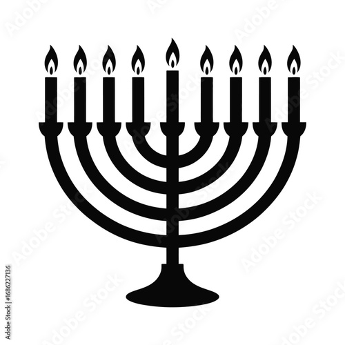 Silhouette of a menorah with eight burning candles and a central shamash