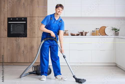 Young male janitor with mod...