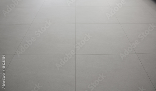 The living room has a beige hardwood floor.