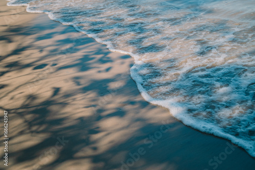 Fototapeta Naklejka Na Ścianę i Meble -  In summer, we travel to the beach where the ocean meets the sea, water sparkles under the sun, and nature’s beauty turns every vacation into a perfect escape.