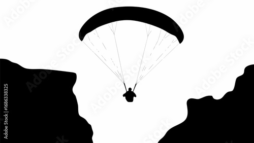 Silhouette of a paraglider in flight between two cliffs against a stark white background in monochrome art