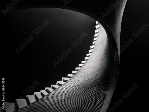 Abstract geometry in staircase form inspiring youth to explore structure and creative design
Spiral staircase in black void promoting peaceful reflection and architectural imagination