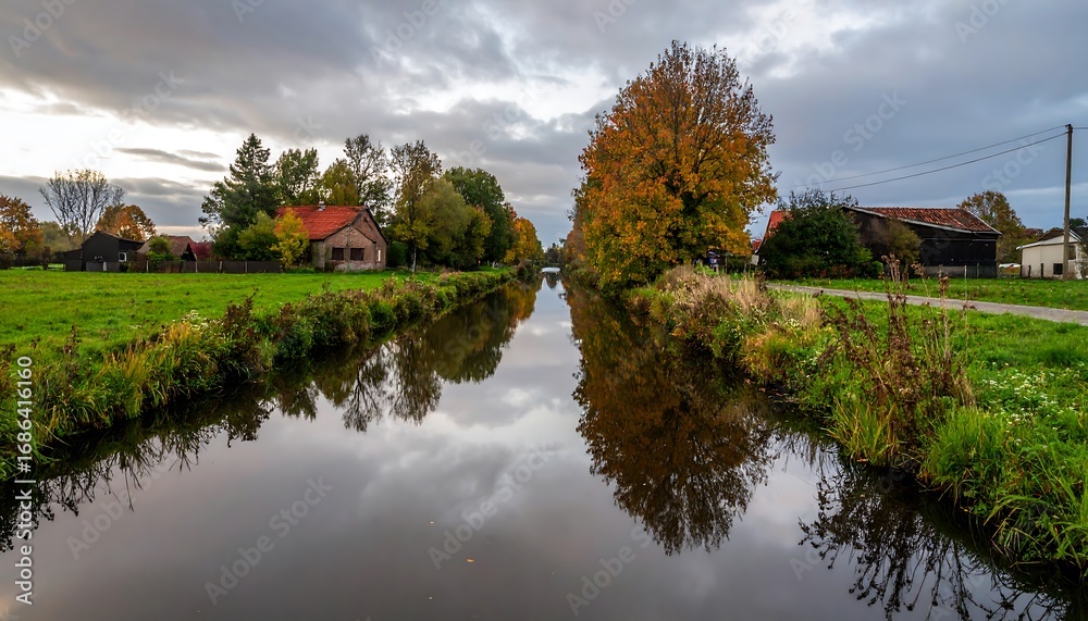 Fototapeta premium Autumnal canal scene with reflections