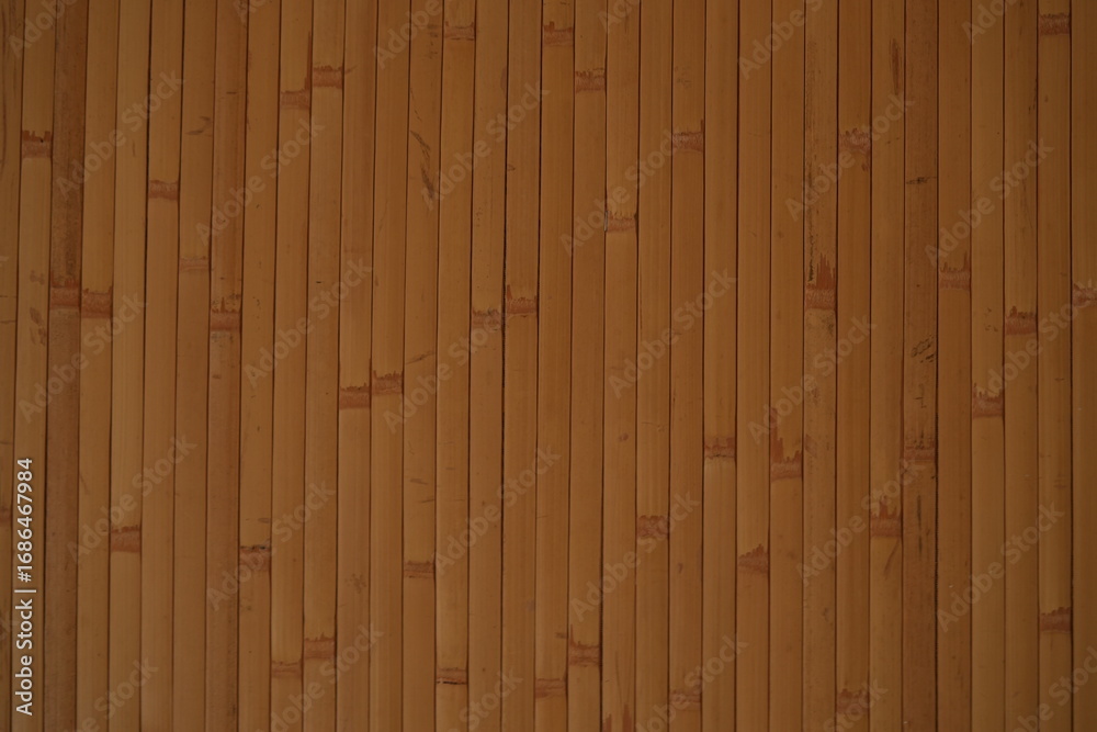 Naklejka premium Bamboo wood panel texture, vertical bamboo slats, natural brown wooden background