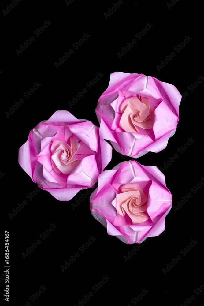 Fototapeta premium Origami is a traditional Japanese paper craft in which colored and patterned paper is folded into shapes such as animals and flowers. This piece is a lotus flower.