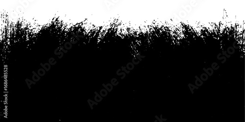 Grunge grass silhouette with black ink splatter pattern and a floral border design