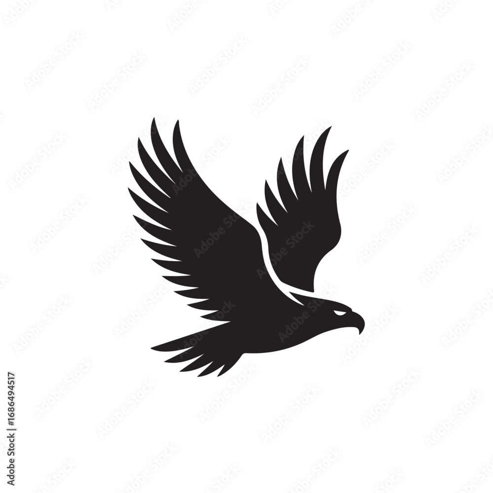 Obraz premium Silhouette of a black eagle in flight against a white background