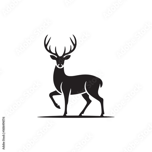 Silhouette of a majestic stag with impressive antlers walking