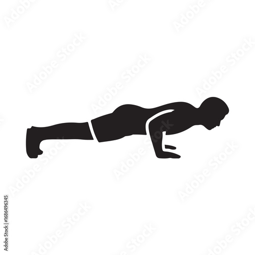 Silhouette of a man performing a push-up exercise