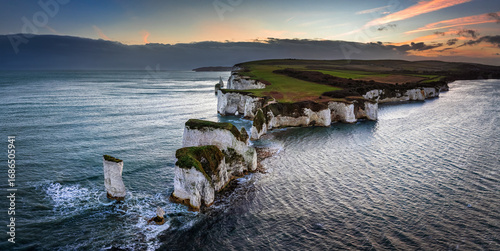 Φωτογραφία Studland, Dorset, UK - Aerial panoramic view of Old Harry Rocks white cliffs at sunset with dramatic sky