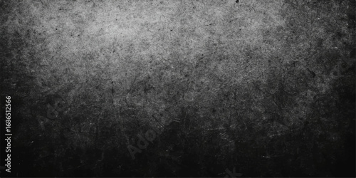 Grungy, textured gray concrete wall with a vintage, aged, and dirty black surface pattern for a dark backdrop