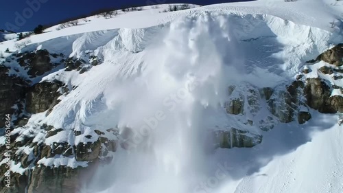 Powerful Snow Avalanche Descending Mountain Slope in Winter