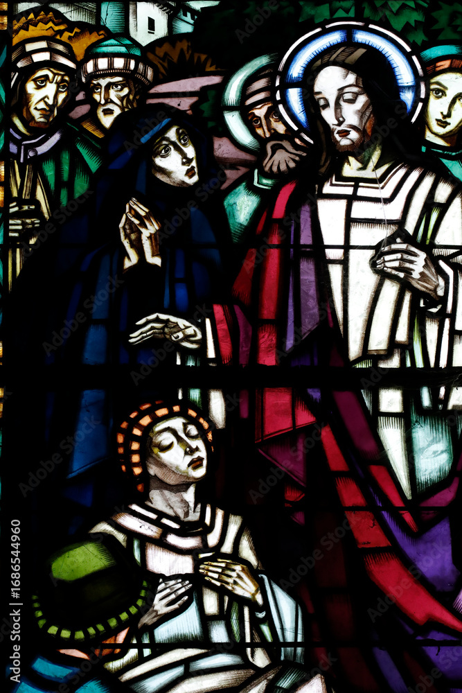 Fototapeta premium St Claude la Colombiere chapel. Stained glass window. The raising of the son of the widow of Nain is an account of a miracle by Jesus. Paray le Monial. France.