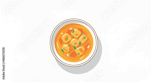 Overhead view of a bowl of delicious soup with dumplings.