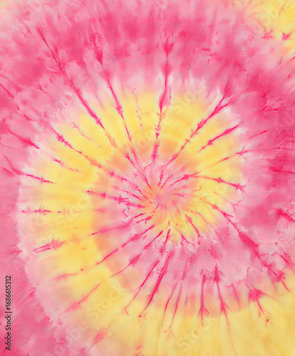 Vibrant tie-dye pattern in shades of pink and yellow