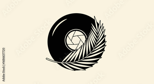 Creative logo design combining camera lens aperture and tropical palm leaf.