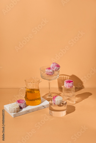 Homemade Chinese snow skin mooncakes. Snowy Moon cakes on a White Background. traditional Asian desserts for Mid-Autumn Festival and seasonal celebrations 