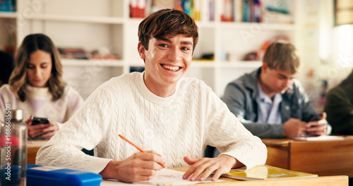 Obraz na plátně High school student, portrait and writing in classroom for exam assessment, quiz and education