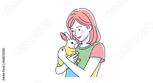 Young girl gently cradles and cherishes a small, fluffy pet rabbit.