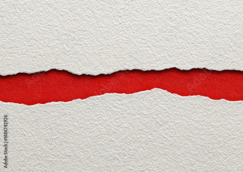 A torn white paper reveals a bold red background. The ragged edges and textured paper create a striking contrast. Close-up and clean shot