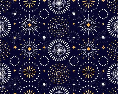 Seamless pattern of abstract fireworks and starbursts on a dark blue background