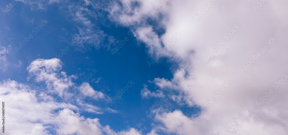 Fototapeta premium Frame of White Clouds on a Blue Sky Background
