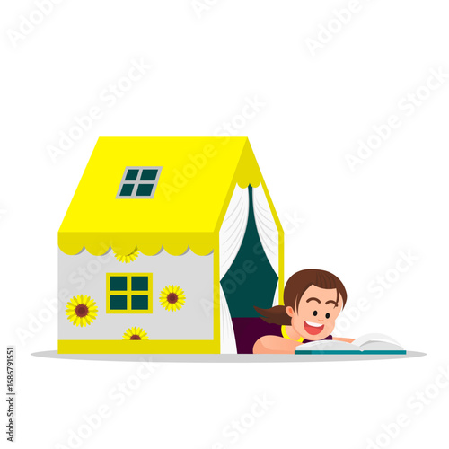 A little girl reads  a book while half her body peeks out from a play tent