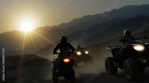 Sunset atv adventure desert mountains outdoor activity dusty trails dynamic perspective thrilling exploration