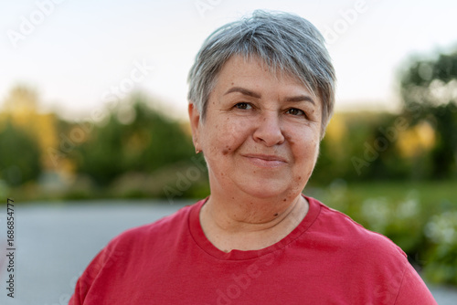 Smiling senior woman enjoying day in park