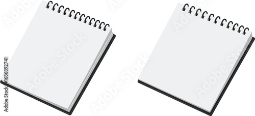 two spiral notebooks with blank pages side by side