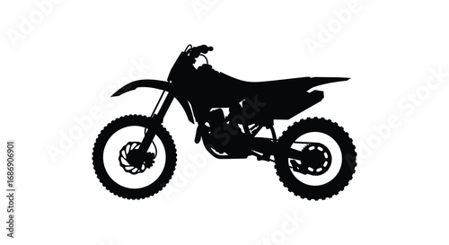 a silhouette of a dirt bike in motion