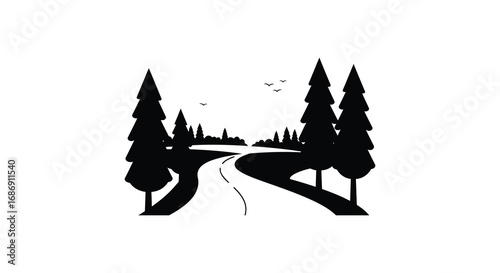 a winding road through dense forest with tall trees