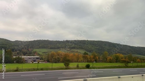 View from the car window on the highway. Car trip across Europe. Car trip along the highway. Trip along the highway view from the window