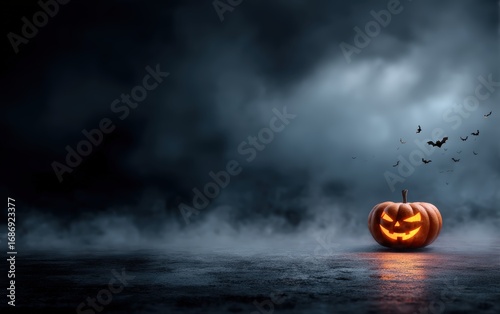 A pumpkin with a scary face is sitting on a wet road