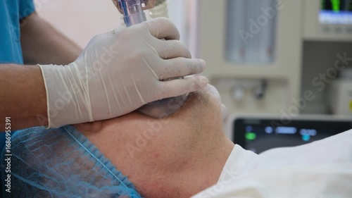Medical professional carefully places an oxygen mask on a patient's face, ensuring proper ventilation during a surgical procedure in a hospital operating room