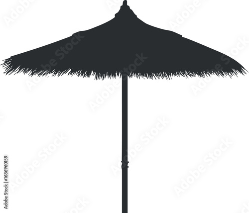 Silhouette of a thatched beach umbrella providing shade for outdoor summer relaxation and sun protection