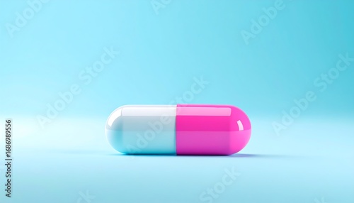 Pink and white capsule on a light blue background