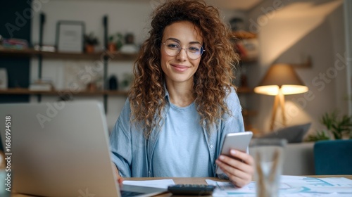 Young Woman Filming Financial Planning Content at Home Workspace