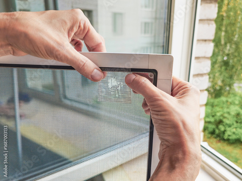 Broken mosquito screen. Repair process.
