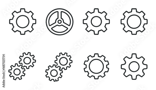 Metallic gear and cogwheel set on dark background illustrating mechanical engineering concepts