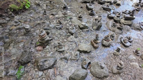 Zen towers of stones along an alpine stream