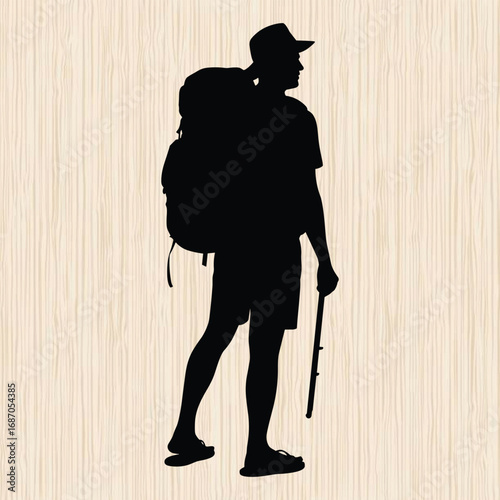 solo traveler standing on the beach wearing a large backpack 