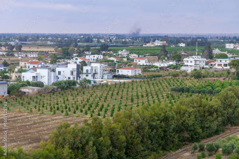 Fototapeta premium View from Rooftop Over Garden and Cyprus Village