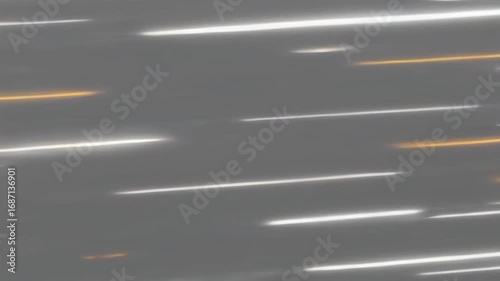 Abstract Motion Blurred Light Streaks Against Gray Background Creating Dynamic Energy and Speed, Featuring White and Orange Trails Suggesting Fast Paced Movement and Energetic Patterns in Dark Setting