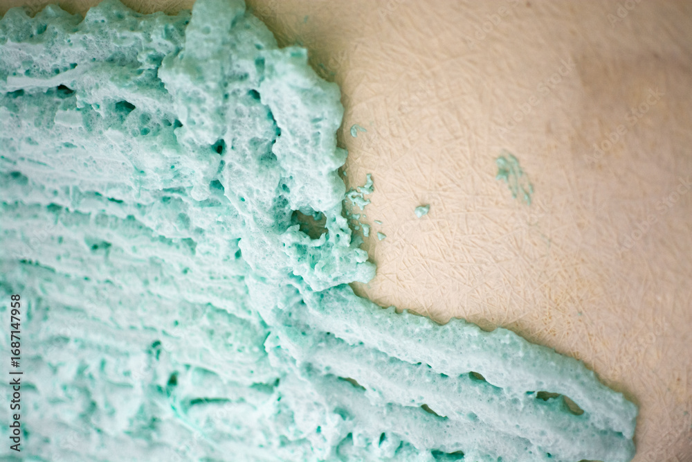 Fototapeta premium Process of applying construction foam to a bathtub for better thermal and sound insulation